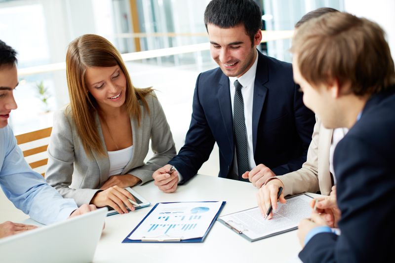 an image of some business people analysing the effects of Improving their Google My Business visibility