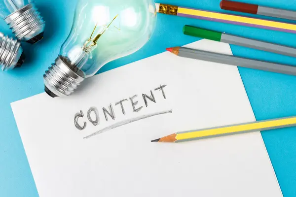 SEO Content Strategy Service: Turn Research Into Revenue-Generating Content, image showing a blank page with the word content and some pencils